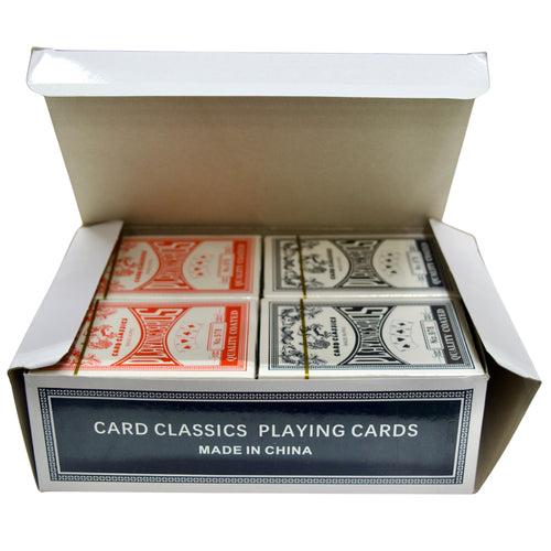 Open box containing two sets of playing cards with visible branding.