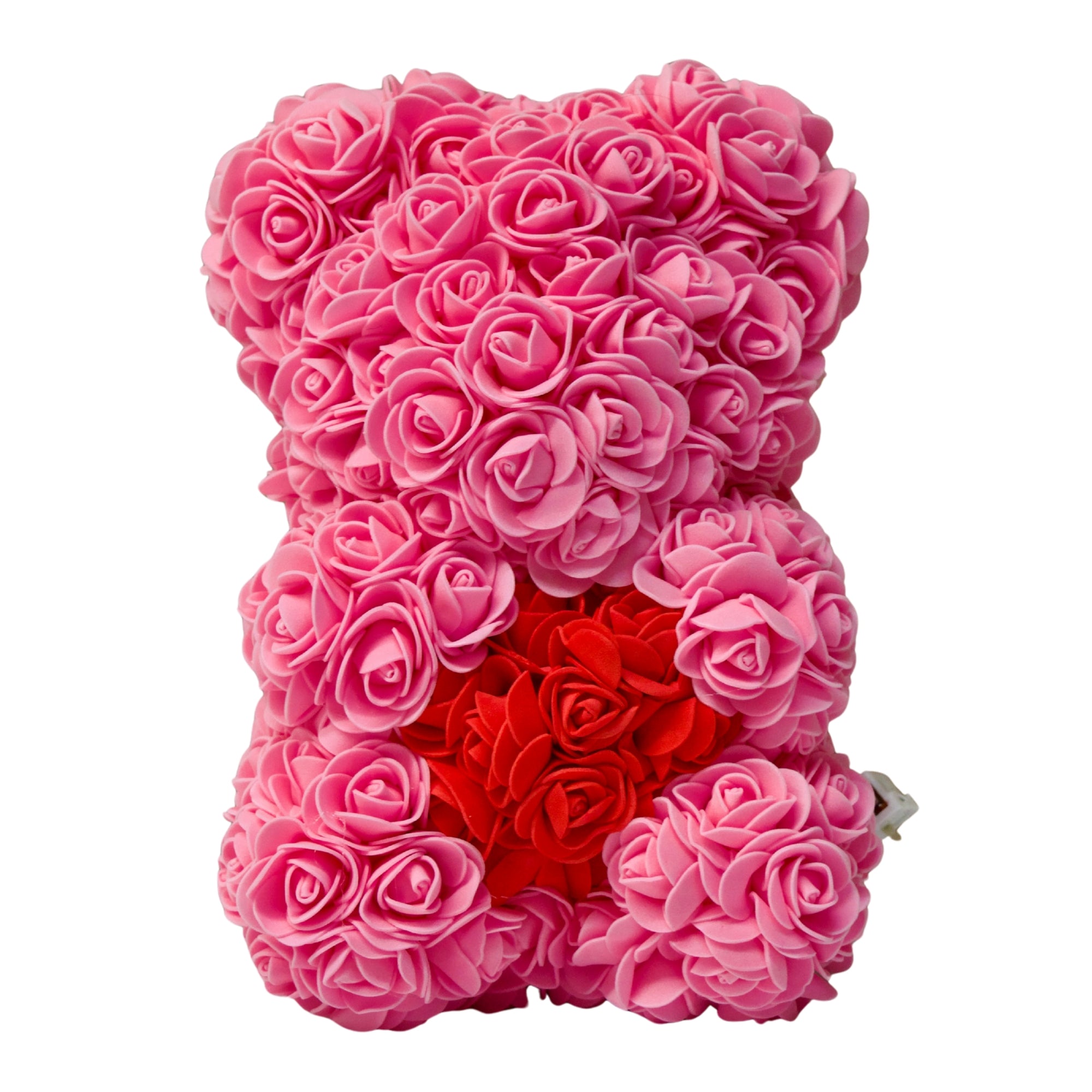 Pink rose teddy bear with a red heart on a white background