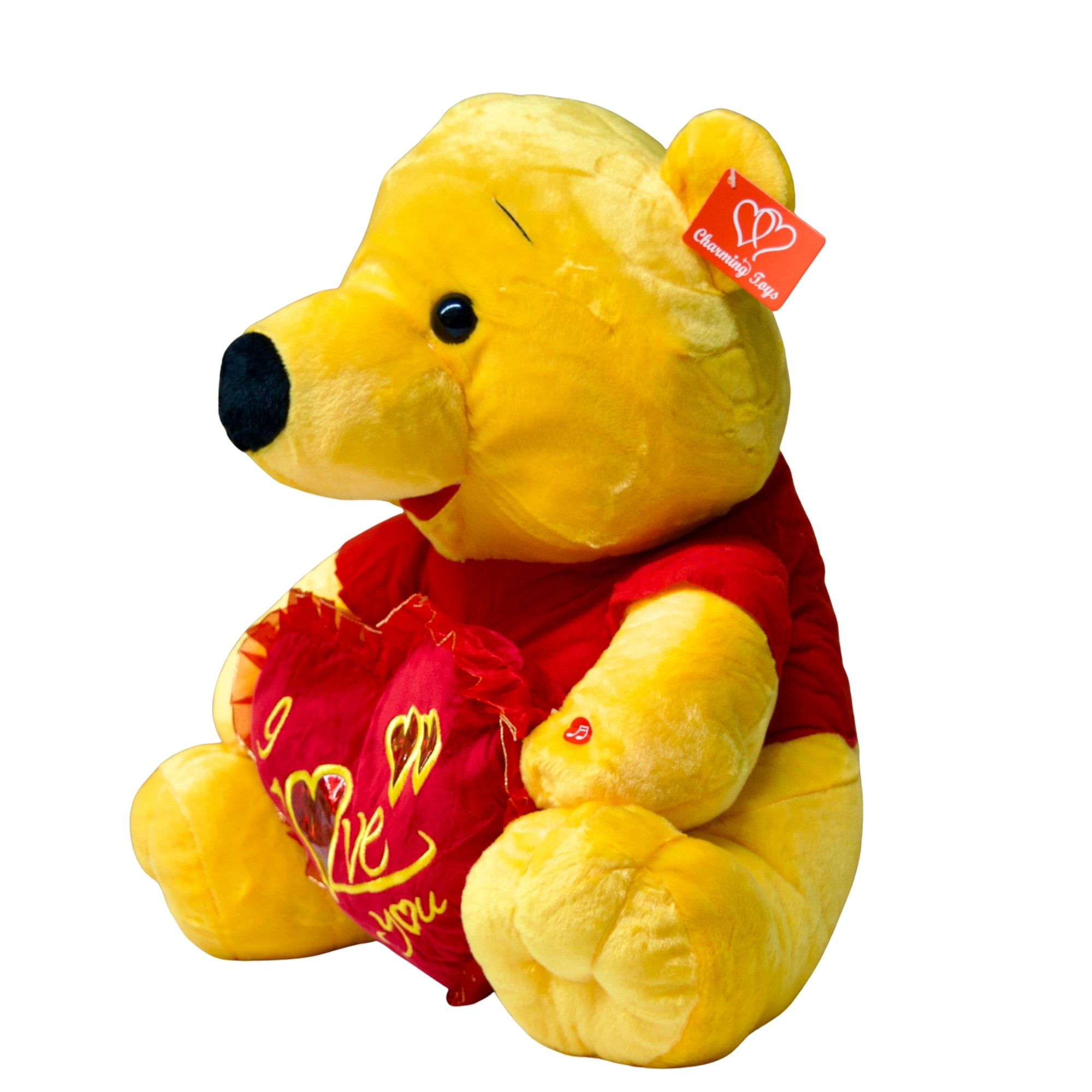 Plush bear toy with a heart-shaped pillow on a white background