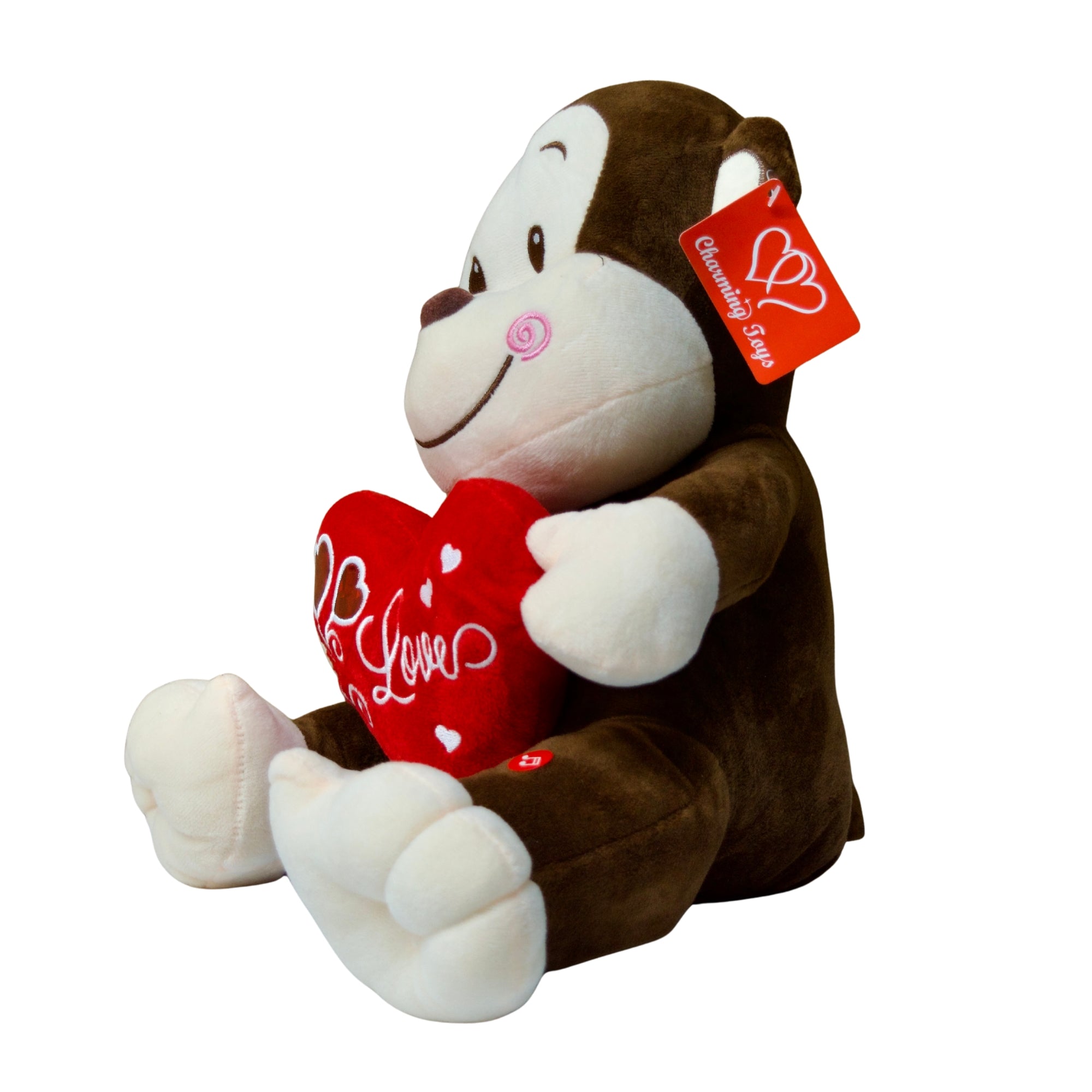 Plush monkey toy holding a red heart with 'I Love You' text on a white background