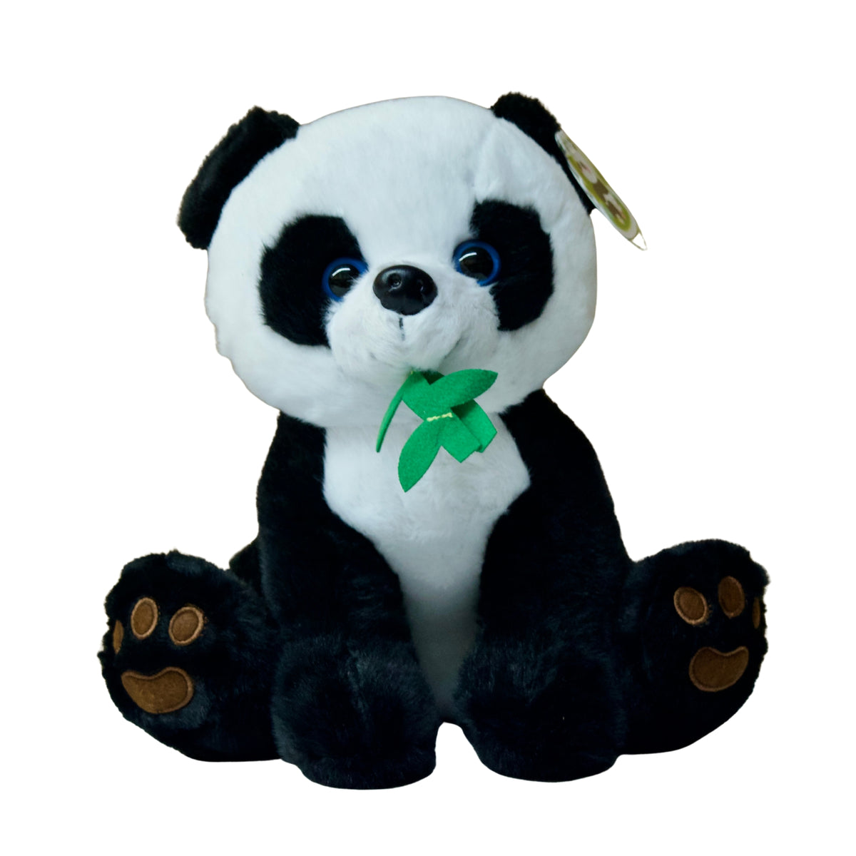 Plush panda toy holding a green leaf on a white background