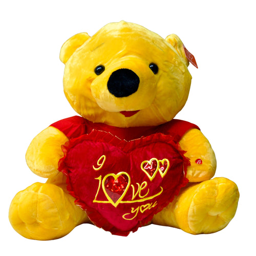 Yellow teddy bear with a red heart that says 'I love you' on a white background